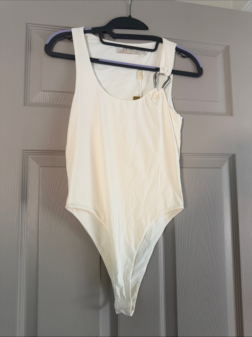 Cream One-Shoulder Bodysuit with Ring Accent